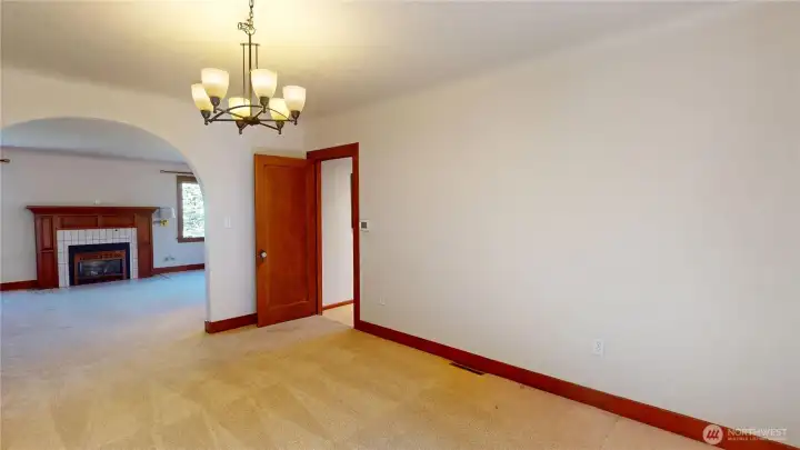 Dining room looking towards arch to living room and door to kitchen