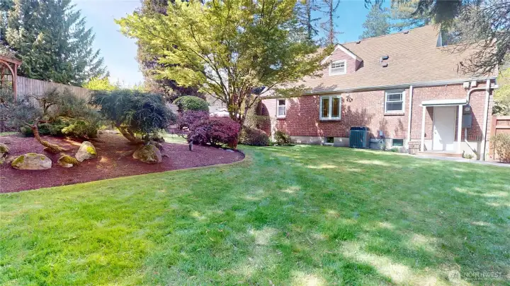 Meticulously maintained backyard of this gorgeous brick tudor home