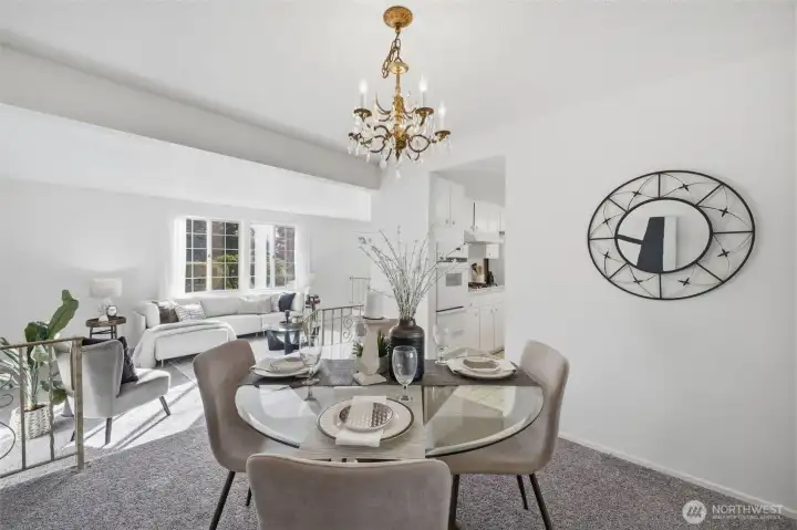 Positioned between the kitchen and the sunken living room, the formal dining room creates a seamless flow for gatherings, entertaining, and everyday meals.