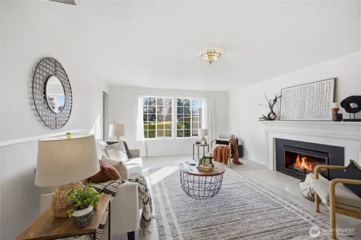 The second living room features a cozy fireplace, providing a warm and inviting atmosphere perfect for relaxing or entertaining.