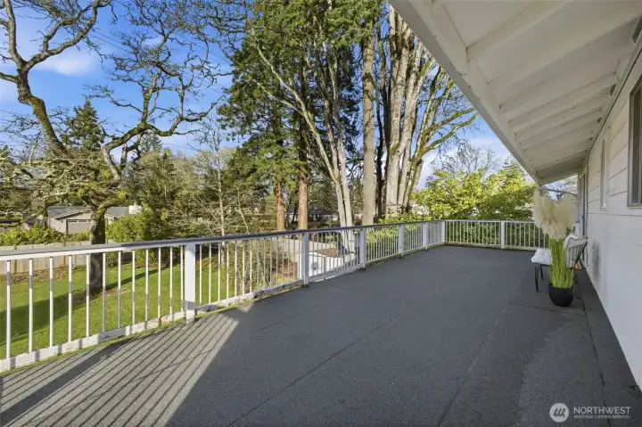 From this angle, the balcony offers a serene view of the backyard, creating a perfect spot for outdoor relaxation and enjoying nature.