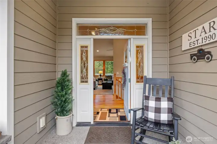 Covered front porch entry to greet your guests. Step inside to an open foyer with a memorable millwork package.