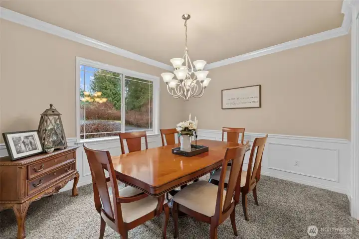Spacious formal dining room with grand appeal.