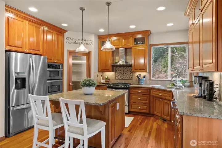 Walk in pantry, kitchen appliances stay with home. Power and storage in the island.