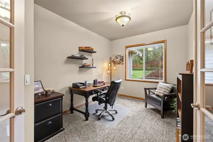 Double doors to the office. Positioning in the floorplan makes working from home a breeze. You can see who is coming and going out front.