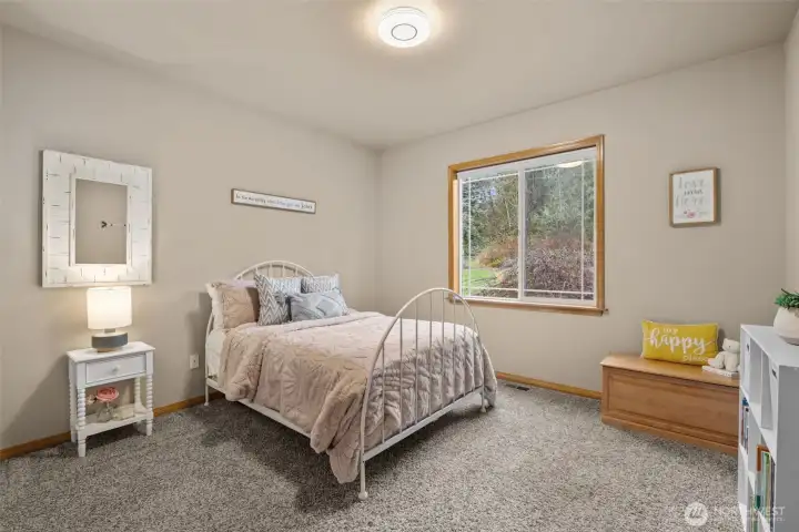 Upper level bedroom adjacent to a 3/4 bathroom.