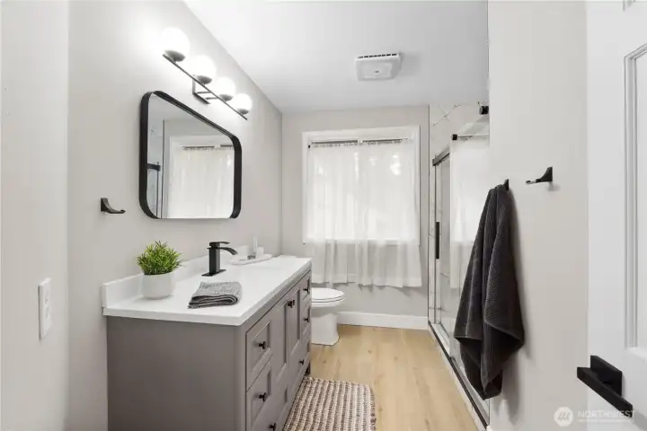 Three-quarter, updated main hall bathroom.
