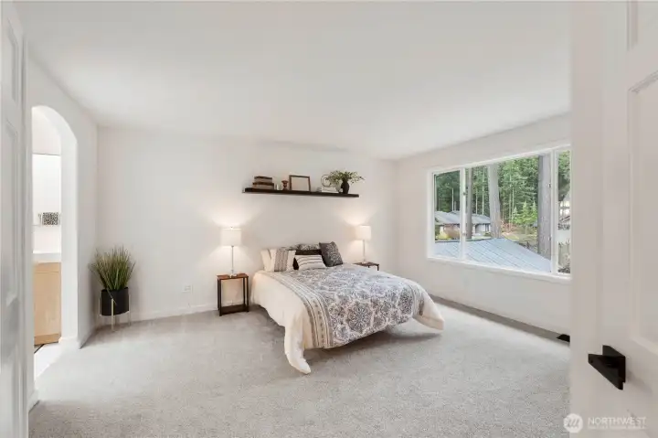 Primary bedroom has new carpet/paint, walk-in closet and updated primary bathroom.