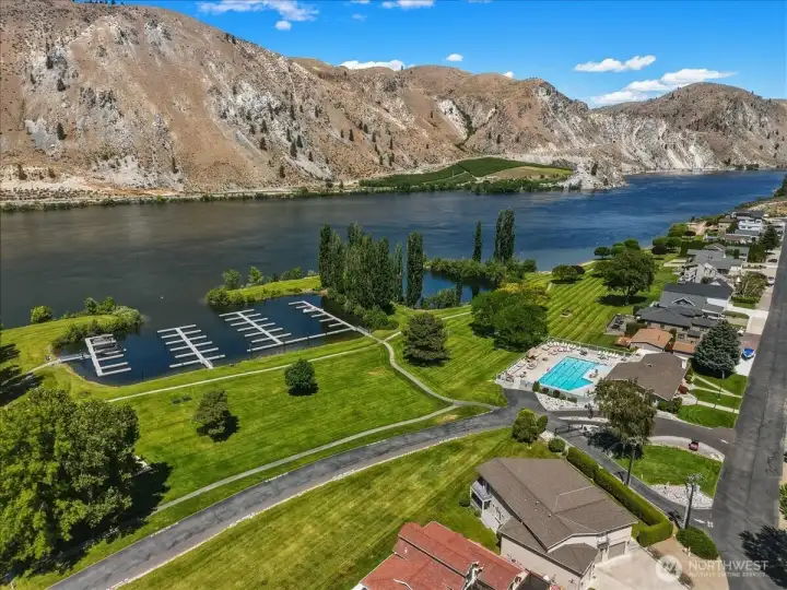 Aerial view 1 of Sun Cove community waterfront with clubhouse, pool, boat launch, marina, parks and playgrounds.