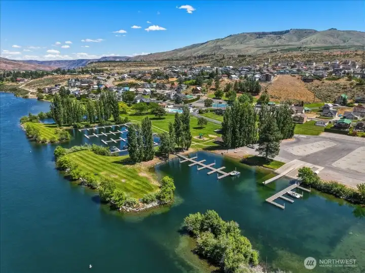 Aerial view 4 of Sun Cove community waterfront with clubhouse, pool, boat launch, marina, parks and playgrounds on the river.