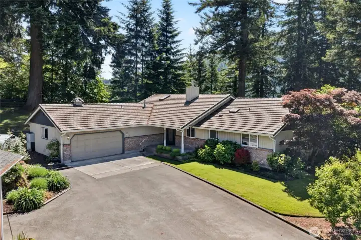 Meticulously maintained and framed by stunning landscaping, this exceptional property showcases the best of one-level living.