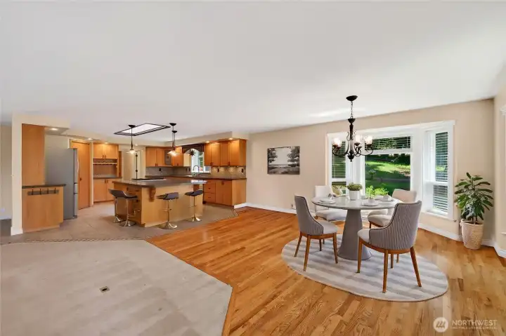A chef's dream, this expansive kitchen offers generous prep space, informal counter seating, and easy access to the dining area, creating the perfect setting for everyday living and entertaining.