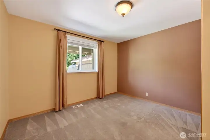 The second guest bedroom provides a comfortable and versatile space, perfect for guests or a home office setup.