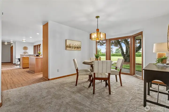 The dining room features floor to ceiling windows with westerly views and allows nature to be it's backdrop.