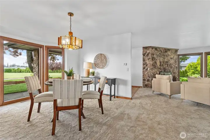 The dining room is perfectly appointed between the kitchen and living room