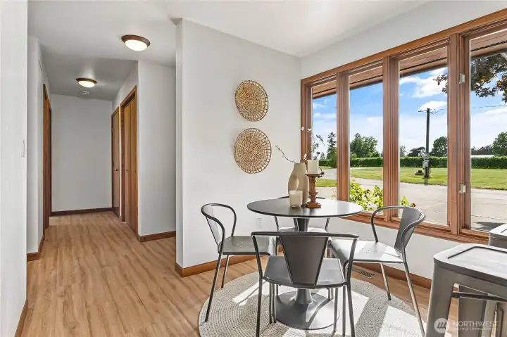 Breakfast Nook and hall that leads to garage and office/den