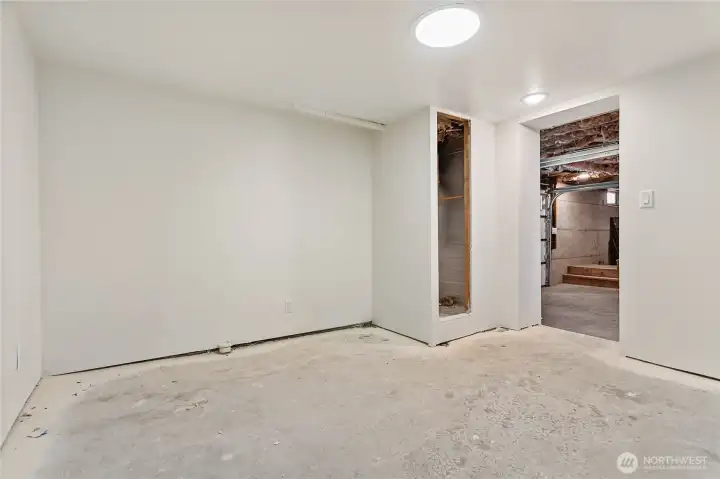 Partially finished room on lower level has plumbing
