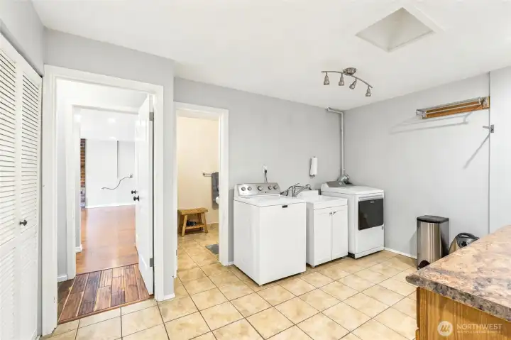 Oversized laundry room with plenty of storage.