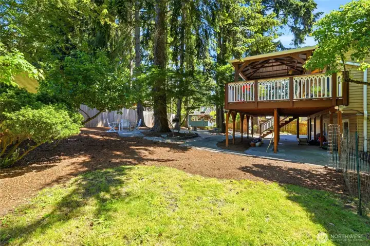 The yard continues with open grass space available for all sorts of activities.