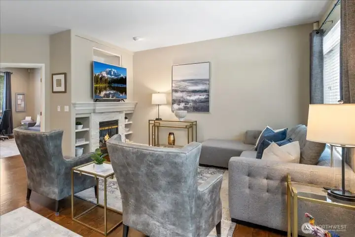 Great room with gas fireplace and built-in bookshelves.