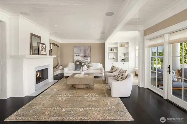 Gas burning fireplace, gleaming hardwood floors and custom built ins complete this generously sized living and sitting room. Gas burning fireplace, gleaming hardwood floors and custom built ins complete this generously sized living and sitting room.