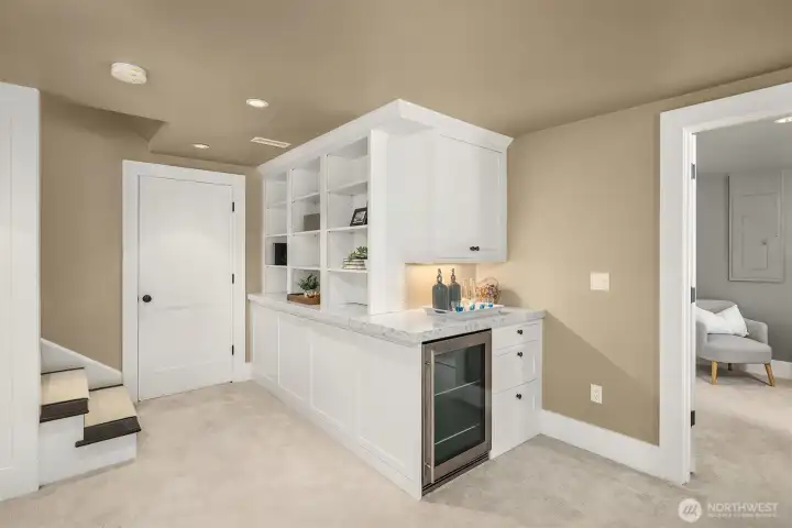 Built in beverage fridge and additional storage Built in beverage fridge and additional storage