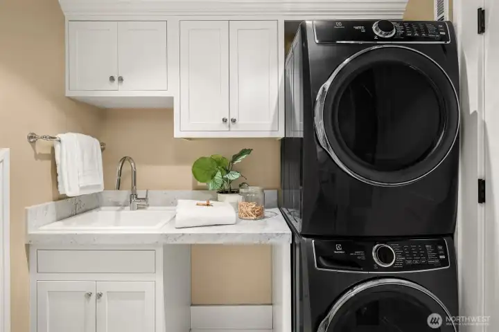 Laundry room with more storage and utility sink Laundry room with more storage and utility sink