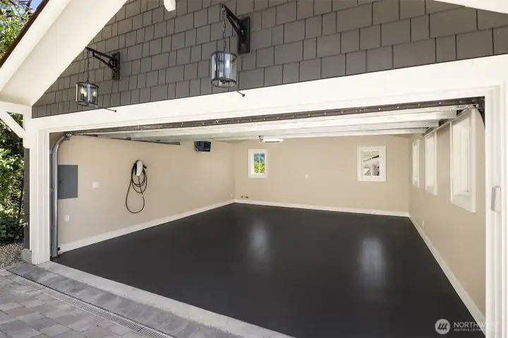 Two car garage with tesla charging. Two car garage with tesla charging.