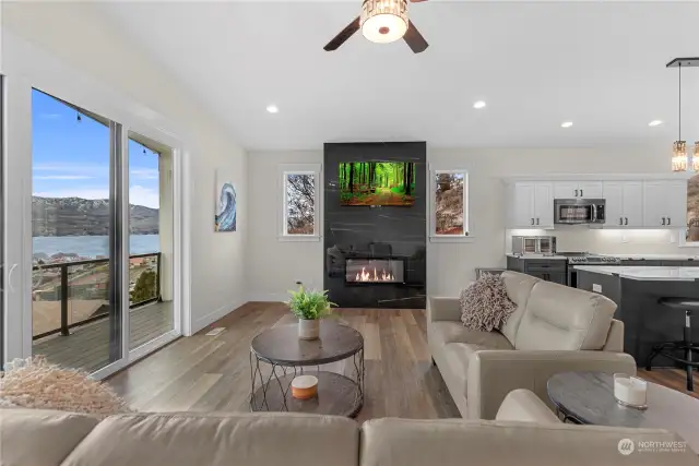 The TV located over the electric fireplace is conveniently placed while not taking away from the Lake Chelan view.