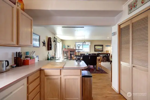 Well lit kitchen with laminate countertops