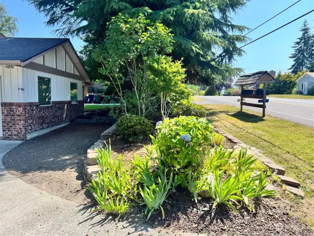 RV, Boat, ATV, extra cars guest parking to the right of the garage. Need more parking / driveway space? Move the garden bed out for more options! All that and still a large driveway & garage!