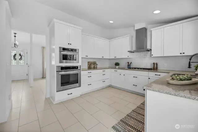 Beautiful newer cabinets, hardware,  new appliances, tile floors. The vaulted ceiling adds to  generous open space, and makes the room even brighter.