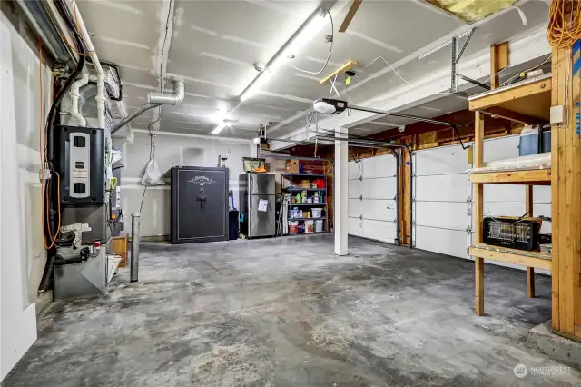 view of garage from the other side. Storage shelves. electric openers