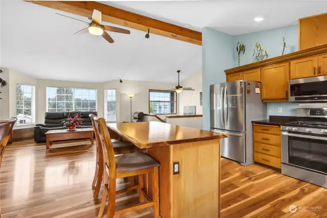 exposed beam is a wonderful upgrade along with the newer appliances. The gas stove & refridgerator are AMAZING. Kitchen island w/outlets makes a wonderful breakfast bar.