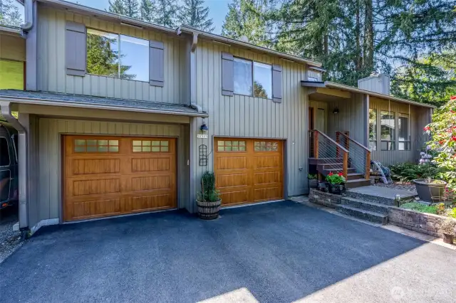 New High End Garage doors and matching Front Entry door with incredible whole door locking mechanism.