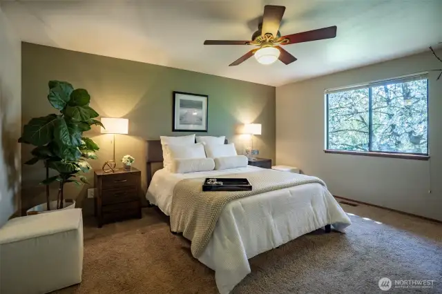 Spacious Primary Suite is appointed with a large Tiled Walk-in Shower and Updated Cabinets, Counters & Fixtures.