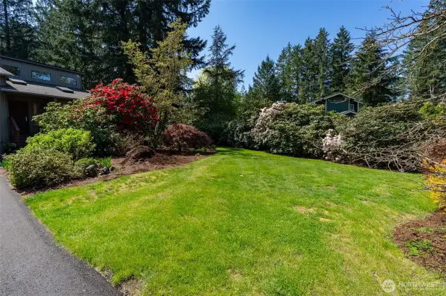 Gorgeous Blooming Yards shows the 30 Plus years the owners have put into these Gardens & Yards and Home.