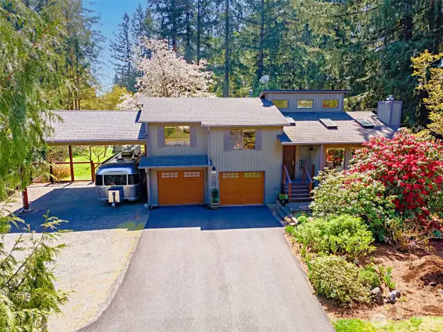 High permitted RV Car Port with RV Hook ups ready for your Travel Trailer - 5th Wheel and can fit more vehicles plus Tons of Graveled Parking areas.