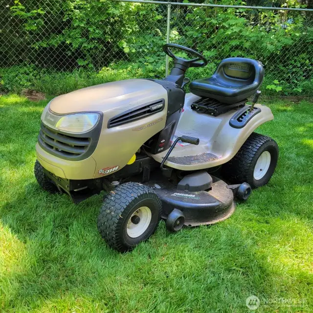 Craftsman Riding Mower stay with home.