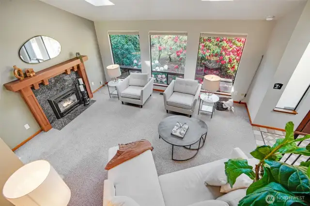 Vaulted Ceiling though Living Room, Dining Room, Entry & Kitchen with large windows and skylight bringing the sunshine in.