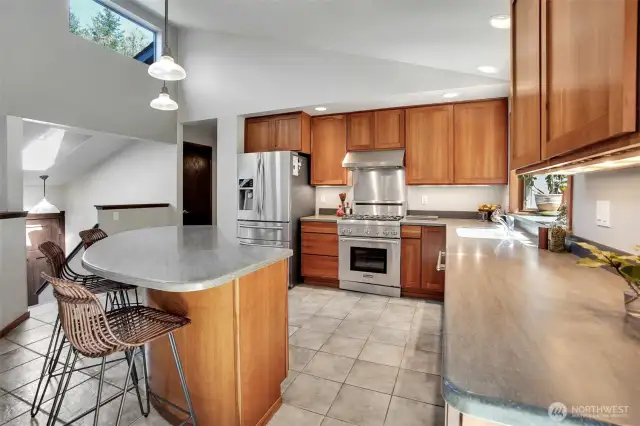 Custom Cherry Cabinets and a fabulous Kitchen Island draws family ad friends to the kitchen.
