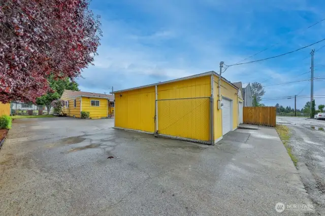 Main House and Detached garage with separate utility meter. Large lot with ample parking & 2nd gated road access in back.
