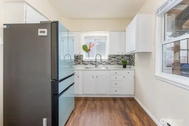 Remodeled kitchen with brand new floors & paint & new appliances