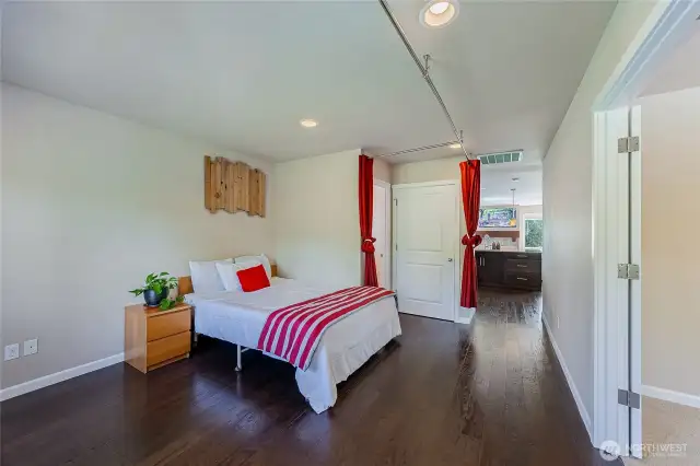 Across from the master bedroom, this upper level bonus area can be curtained or walled off. Home office, 5th bedroom, home gym, yoga studio, baby crib and play area… many possibilities!