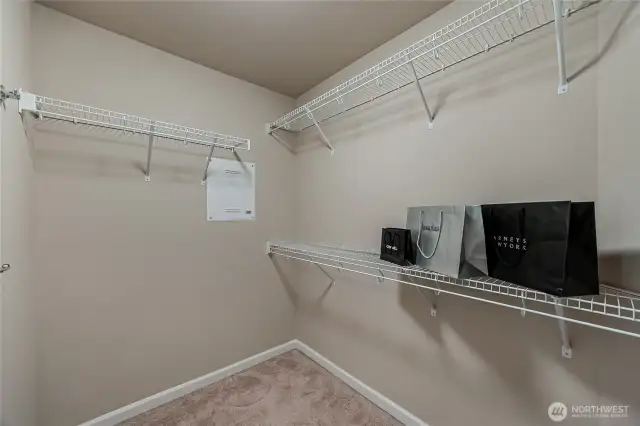 Master’s walk-in closet with prewired panel for internet and security.