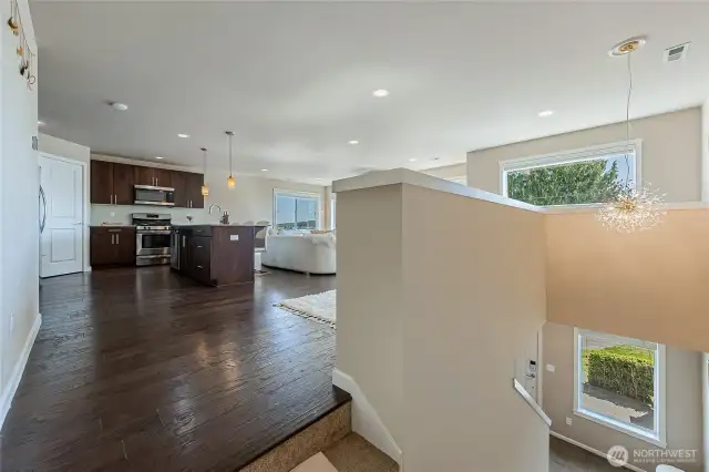 Tall ceilings with upgraded chandelier. Landing at the top of the wide staircase.