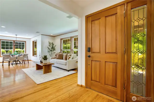 Welcoming entry with gleaming hardwood floors and timeless elegance.