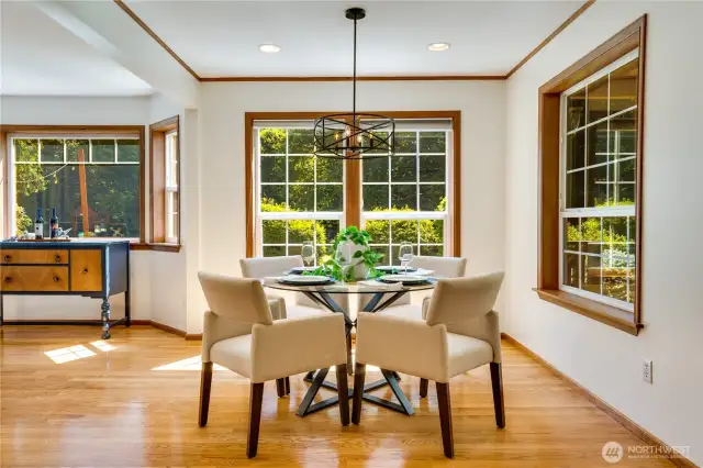Elegant dining room with stunning views of the sprawling, sunlit grounds.