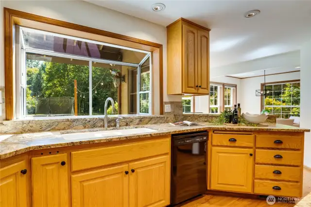 Vibrant kitchen, the heart of the home, with stunning views!