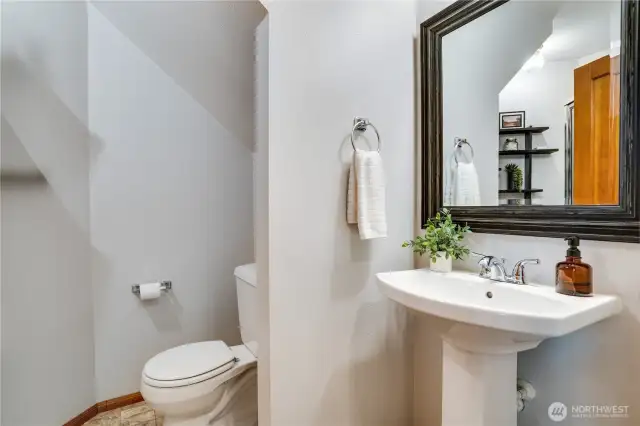 Sleek main-floor 3/4 bathroom with modern elegance and convenience.